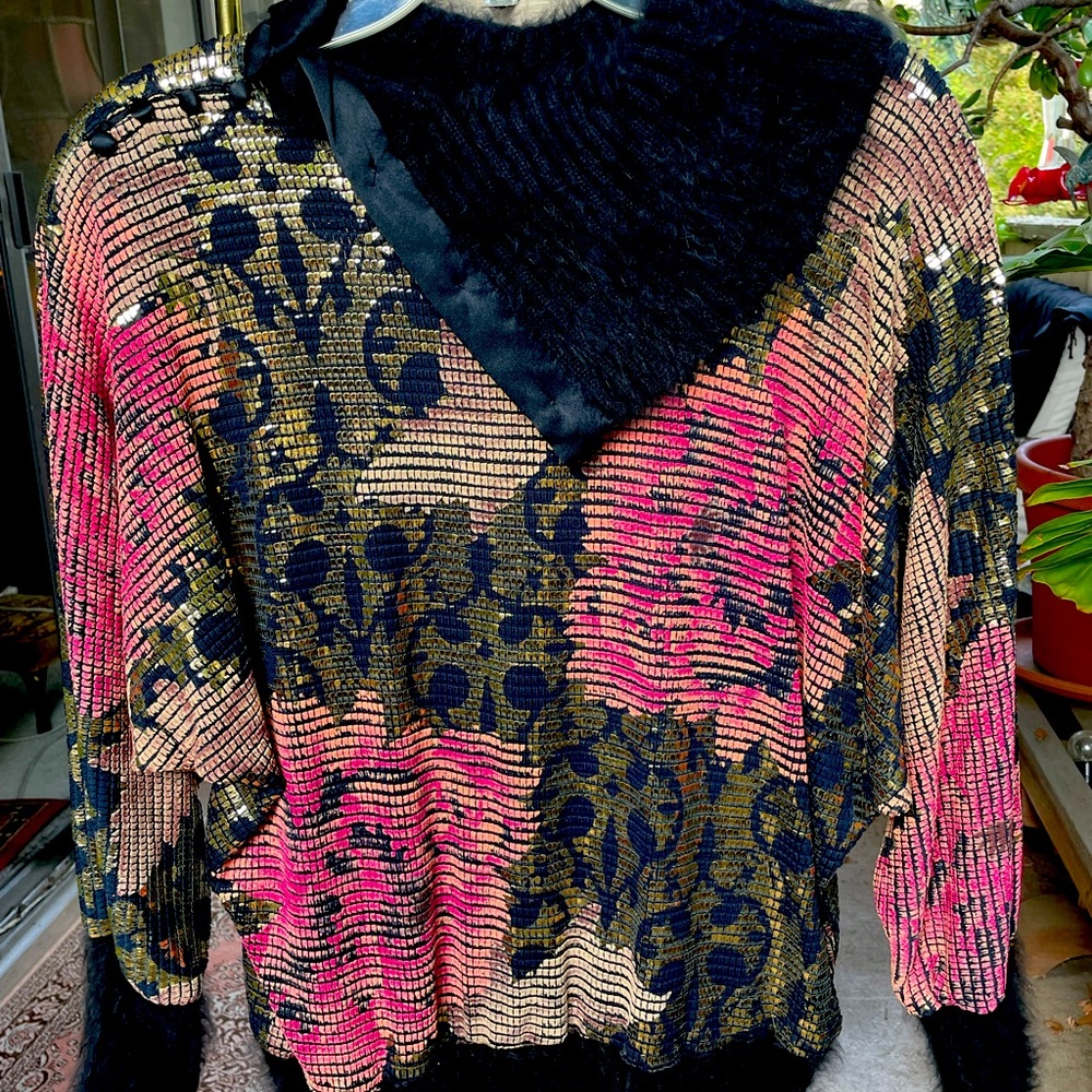 French designer top with angora neck line, cuffs and all around the bottom.